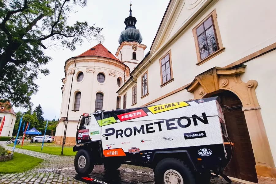 Dakar trucks on the courtyard of Brevnov Monastery with Martin Macík Jr.